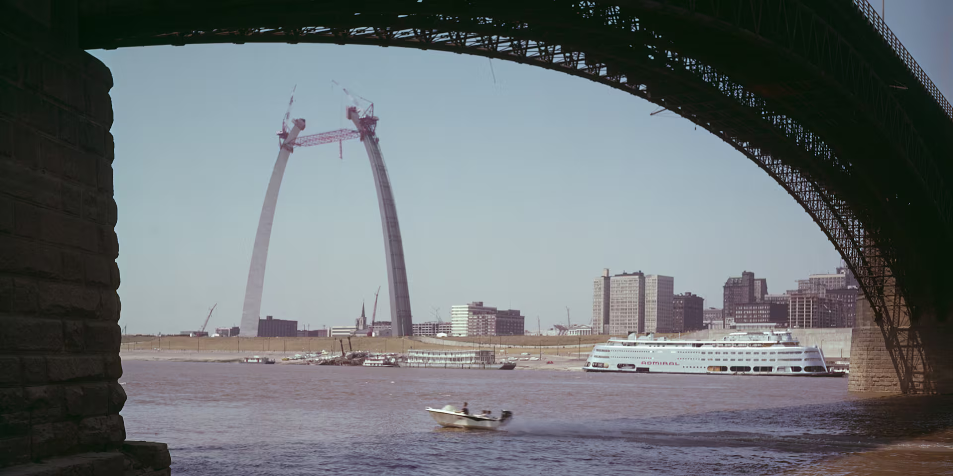 St. Louis riverfront and Gateway Arch viewed from beneath a bridge